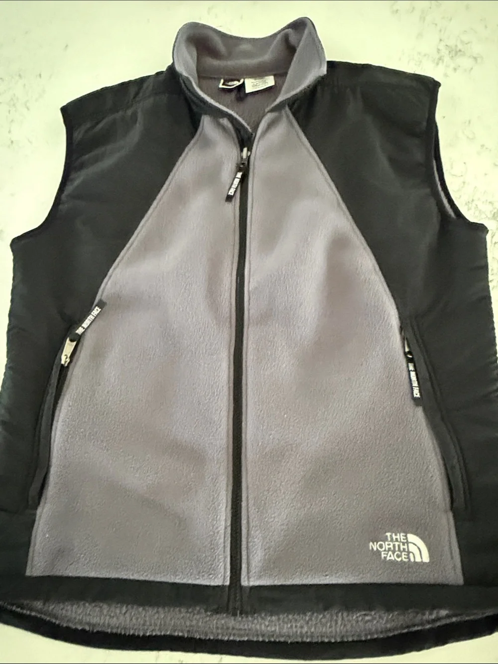 The North Face Black Shell with Gray Fleece-Lined Men's Vest